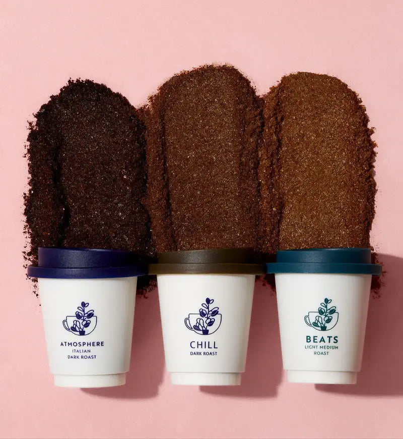 Three coffee cups with grounds on pink background | Cozy Indigo Coffee