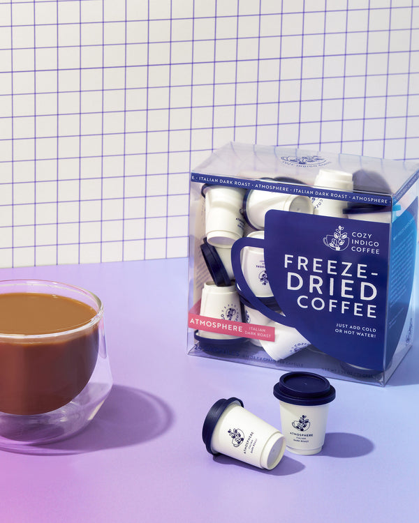 Freeze-dried coffee ATMOSPHERE with a cup of coffee on a checkered background