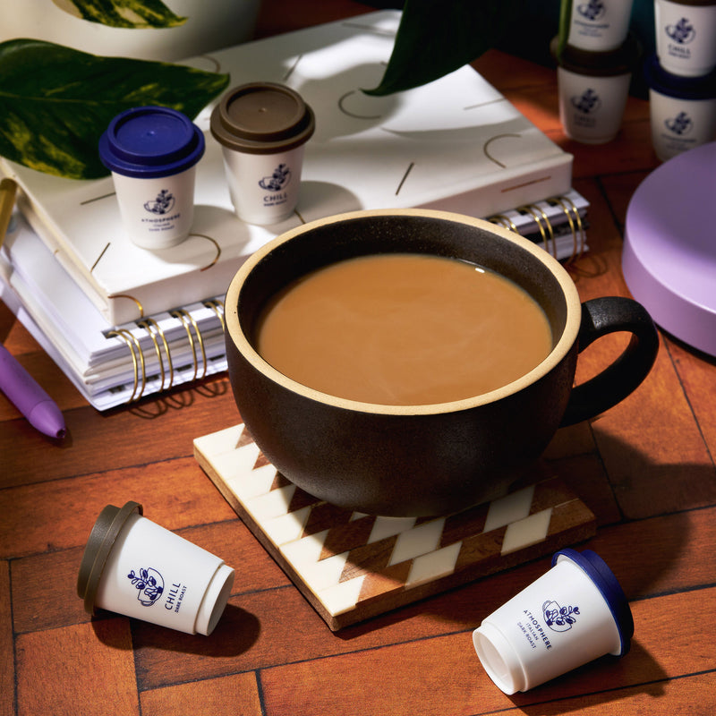 Dark coffee mug with cups and notebooks | Cozy Indigo Coffee